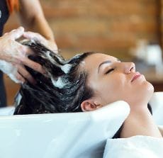 httpselements.envato.combeautiful young woman washes hair in a beauty salo DLZYVXK 1